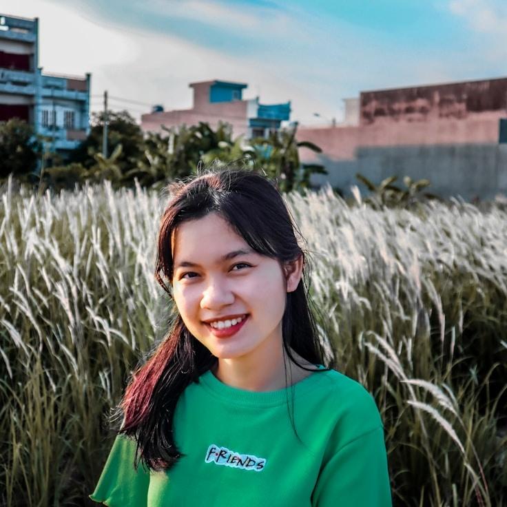 Avery Chen, Lead Design Curator at Global Logic Infrastructure, reviewing corporate floral arrangements